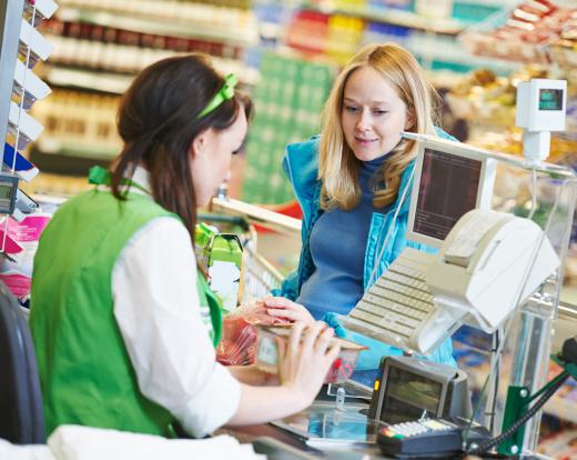 Supermarket cashiers scan customers' items and coupons, collect their money, distribute receipts and change and, often, bag the customer's groceries.