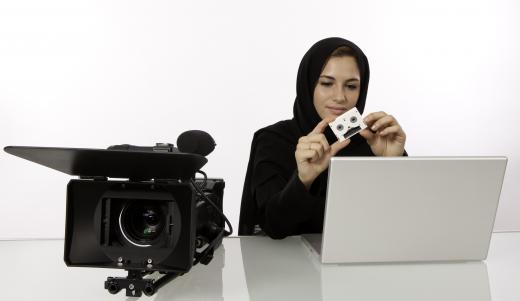 A freelance video editor will work with computers and software to cut, add, or rearrange scenes in a video.