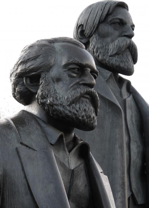 Sculpture of Karl Marx (foreground), a supporter of progressive taxes; and Friedrich Engels.