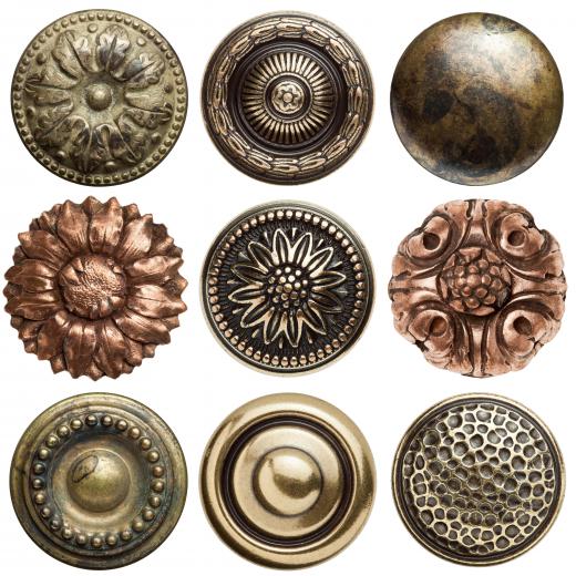 A collection of vintage metal buttons.