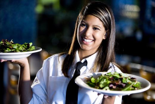 Waitresses provide customer service to the patrons they serve in restaurants.