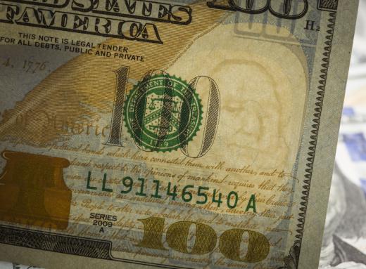 A real US bill will reveal a watermark when held up to a light source.